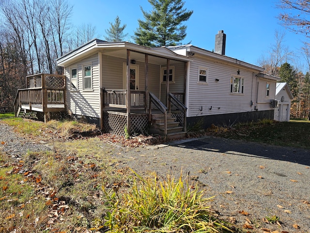 view of front of property with a wooden deck