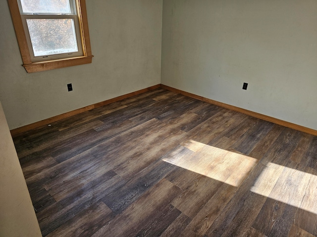 empty room featuring dark wood-type flooring