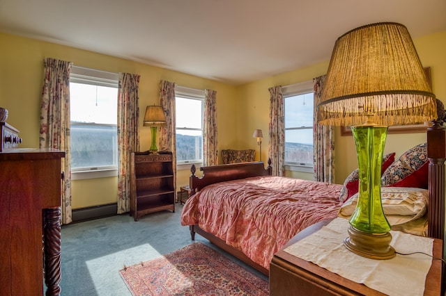 carpeted bedroom with a baseboard heating unit