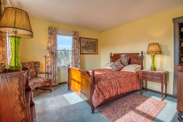 bedroom featuring light carpet