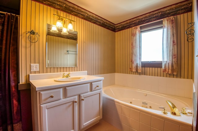 bathroom with vanity and tiled bath