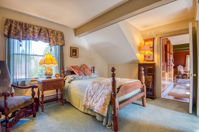 carpeted bedroom with baseboard heating and vaulted ceiling with beams