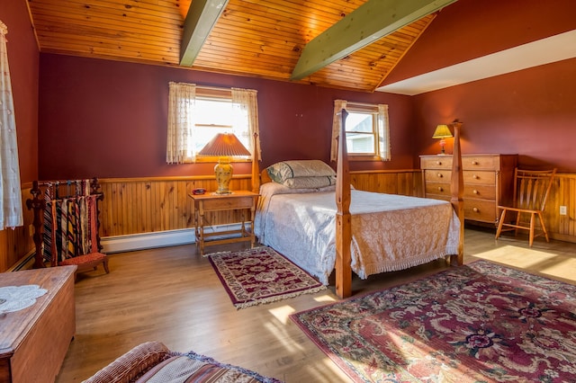 bedroom with wooden ceiling, baseboard heating, light hardwood / wood-style flooring, wooden walls, and lofted ceiling with beams