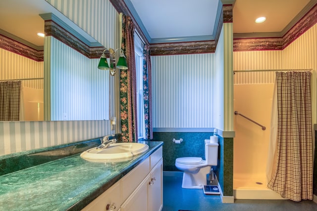 bathroom featuring ornamental molding, vanity, toilet, and a shower with curtain