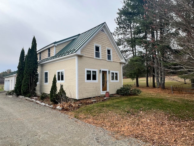 view of home's exterior featuring an outdoor structure