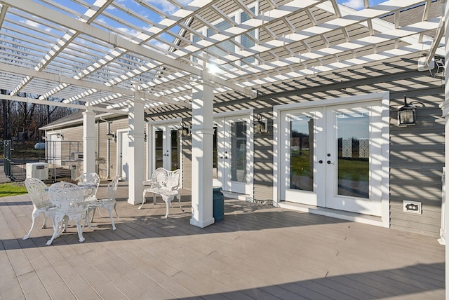 deck featuring french doors and a pergola