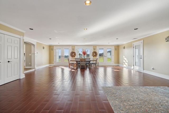 dining area with french doors, ornamental molding, and dark hardwood / wood-style floors