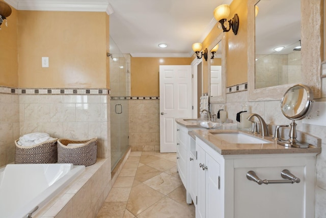 bathroom with tile patterned floors, separate shower and tub, vanity, crown molding, and tile walls