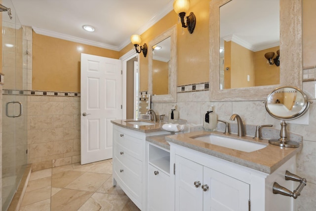 bathroom featuring vanity, an enclosed shower, ornamental molding, and tile walls