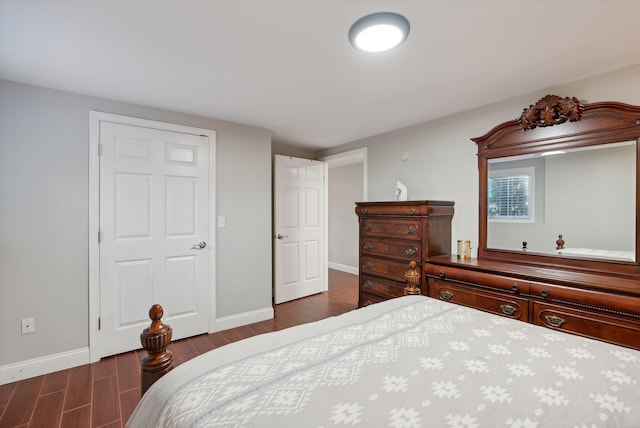 bedroom featuring dark hardwood / wood-style flooring