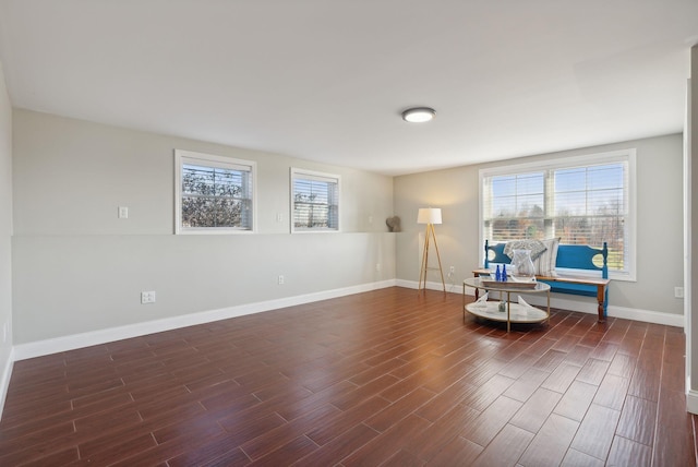 unfurnished room with dark hardwood / wood-style flooring and a wealth of natural light