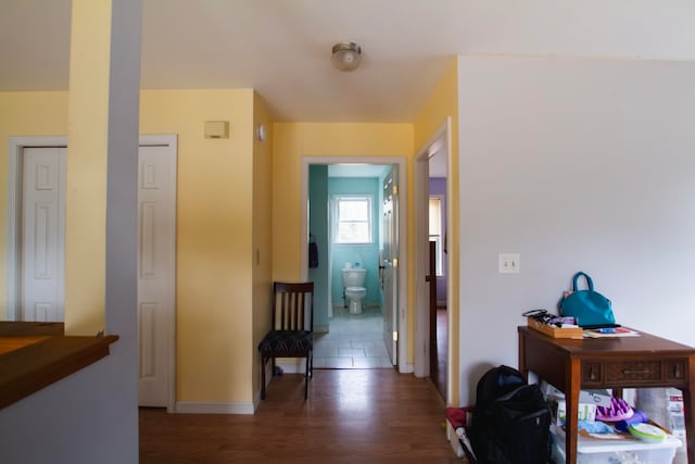 hallway with dark hardwood / wood-style floors