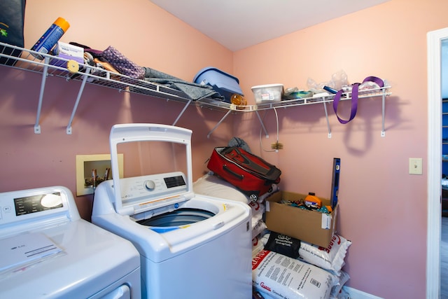 clothes washing area with independent washer and dryer