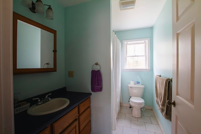 full bathroom featuring toilet, vanity, tile patterned floors, and shower / tub combo