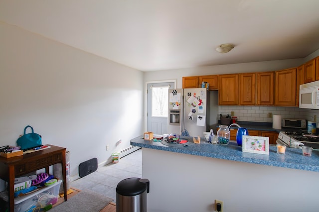 kitchen featuring white appliances, tasteful backsplash, and baseboard heating