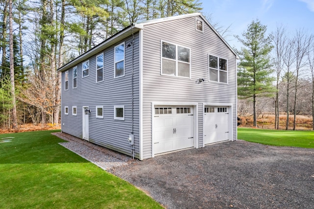 view of home's exterior featuring a garage and a yard