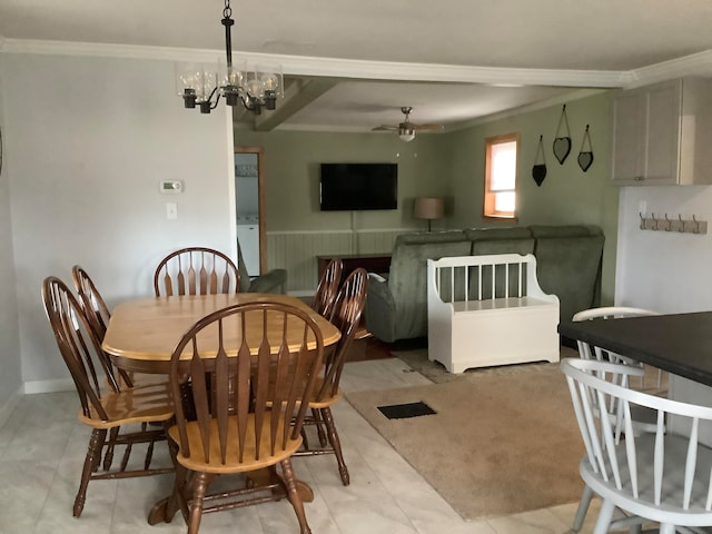 dining area featuring crown molding and ceiling fan with notable chandelier