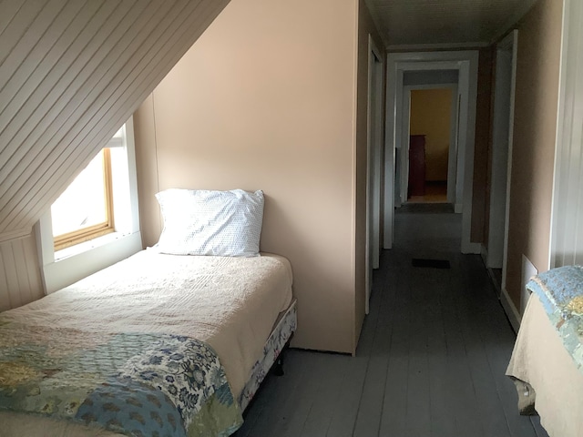 bedroom with dark wood-type flooring