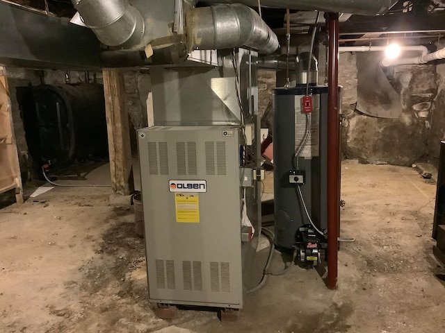 utility room with water heater and heating unit