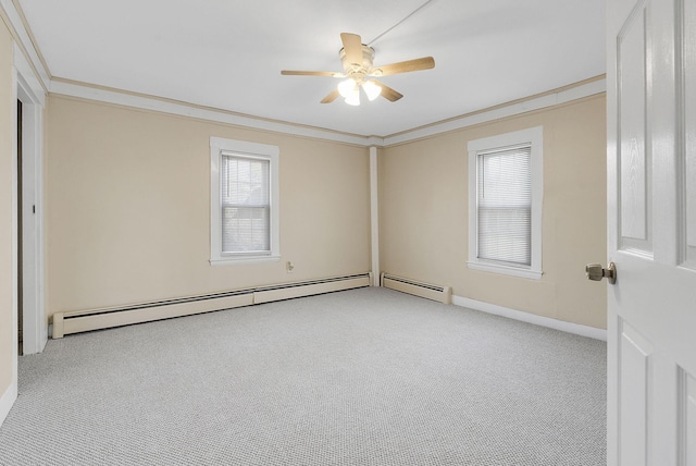 carpeted empty room featuring a baseboard radiator, ceiling fan, and crown molding