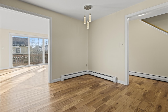 interior space featuring light hardwood / wood-style floors and a baseboard heating unit