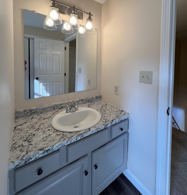 bathroom featuring vanity and hardwood / wood-style flooring