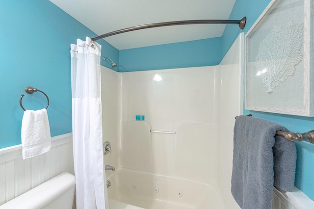 bathroom with toilet and shower / tub combo