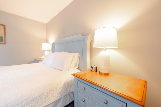 bedroom with lofted ceiling