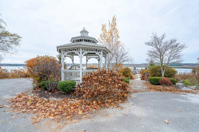 view of property's community featuring a gazebo and a water view