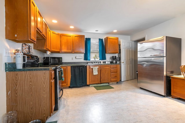 kitchen with black appliances and sink