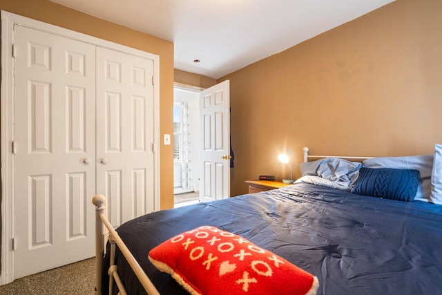 bedroom featuring a closet and carpet flooring