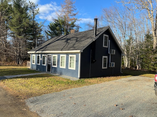 view of home's exterior featuring a yard and cooling unit