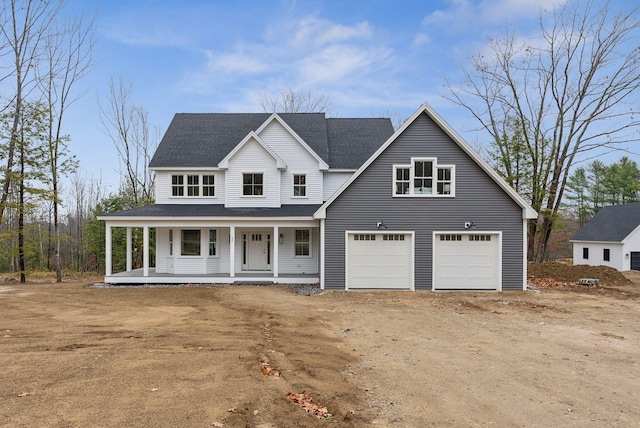 view of front facade featuring covered porch, dirt driveway, roof with shingles, and a garage