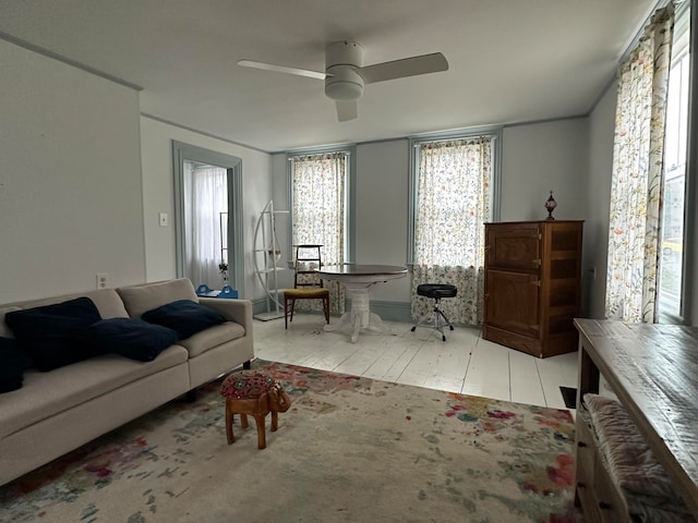 tiled living room featuring ceiling fan