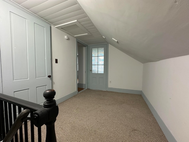 bonus room featuring lofted ceiling and carpet