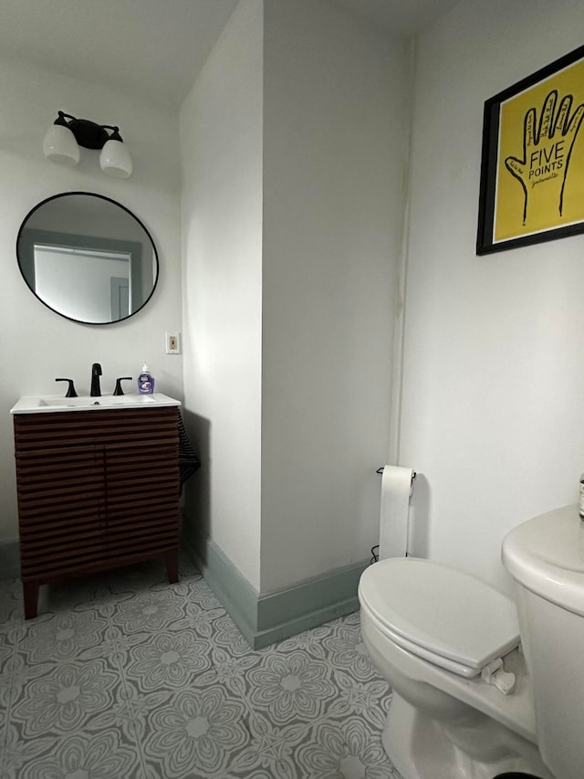 bathroom with toilet and vanity