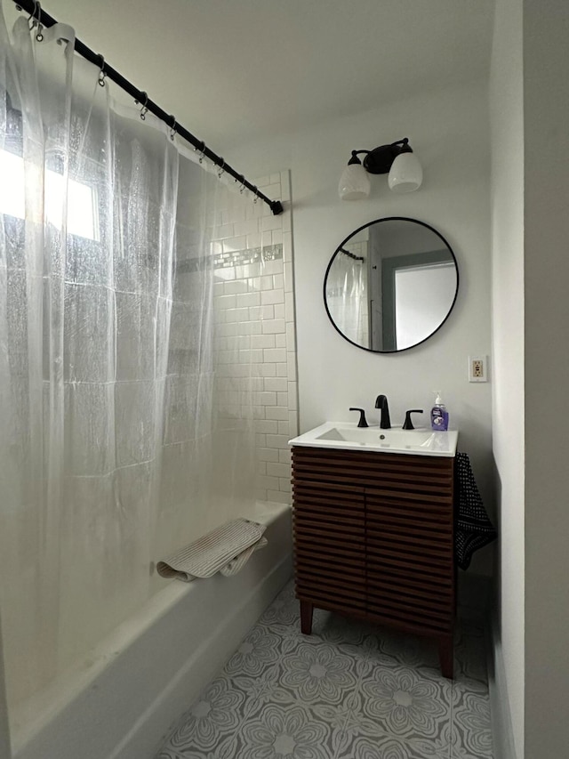 bathroom featuring shower / bath combo and vanity