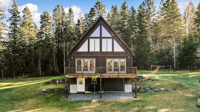 back of house with a yard and a wooden deck