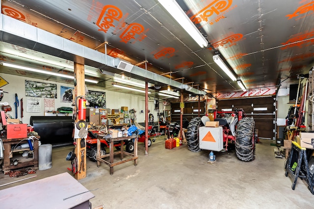 garage with a workshop area