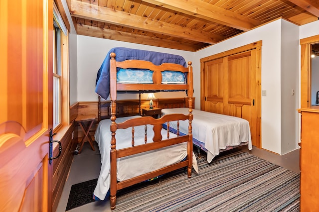 bedroom featuring beamed ceiling and wooden ceiling