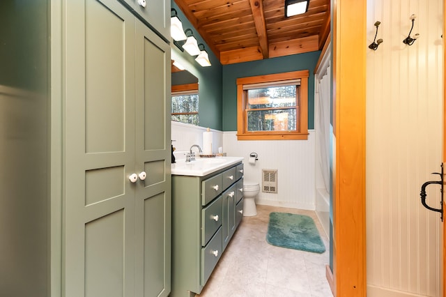 full bathroom featuring wooden ceiling, shower / bath combo, heating unit, toilet, and vanity