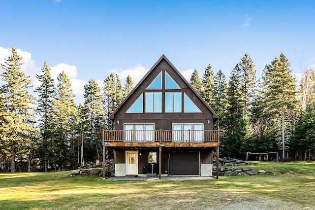 back of house with a wooden deck and a yard