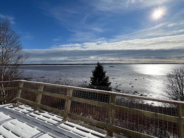 wooden terrace with a water view