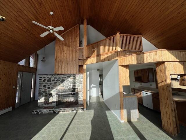 kitchen with dishwasher, wood ceiling, high vaulted ceiling, ceiling fan, and a stone fireplace