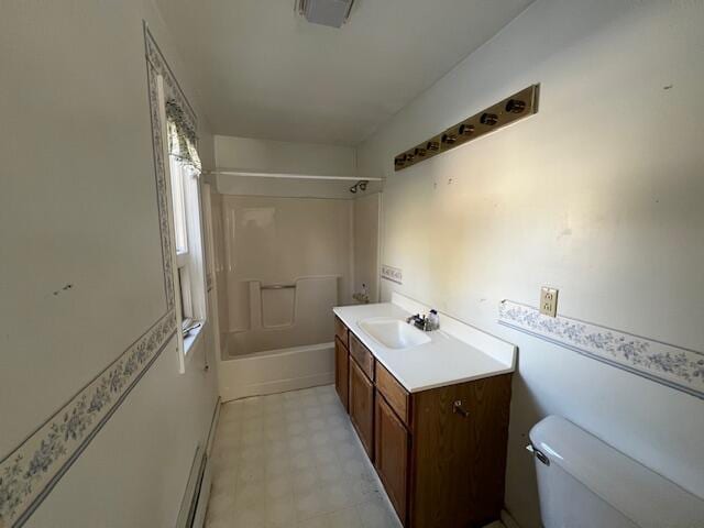 full bathroom featuring toilet, bathing tub / shower combination, and vanity