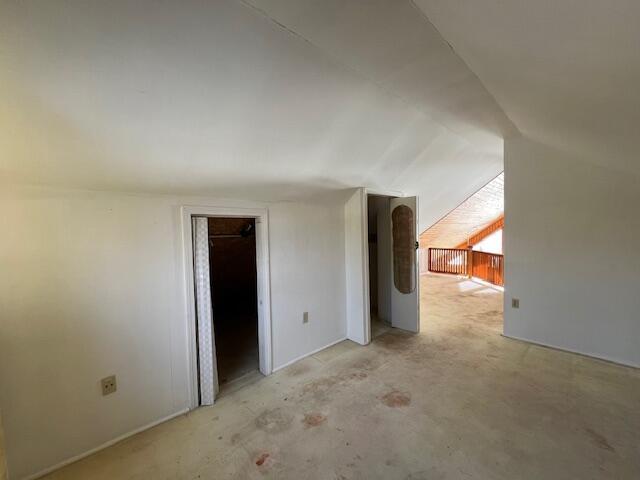 bonus room featuring vaulted ceiling