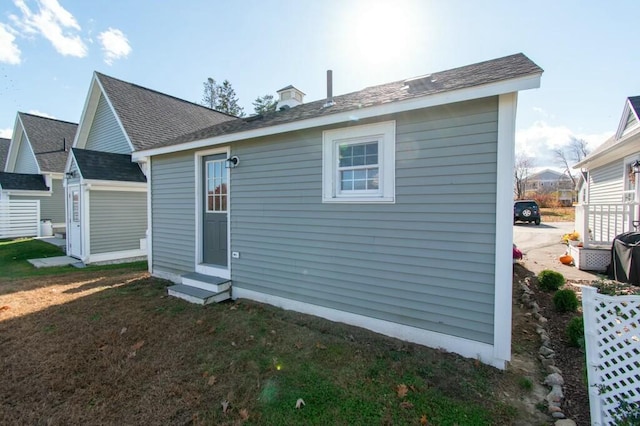 rear view of property featuring entry steps