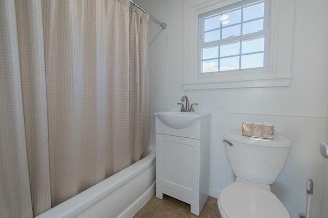 bathroom featuring toilet, tile patterned flooring, shower / bathtub combination with curtain, and vanity