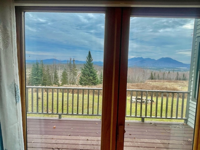 doorway to outside featuring a mountain view