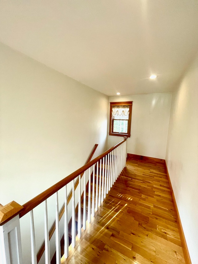 staircase featuring hardwood / wood-style floors